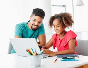 Father helps daughter improve reading comprehension.